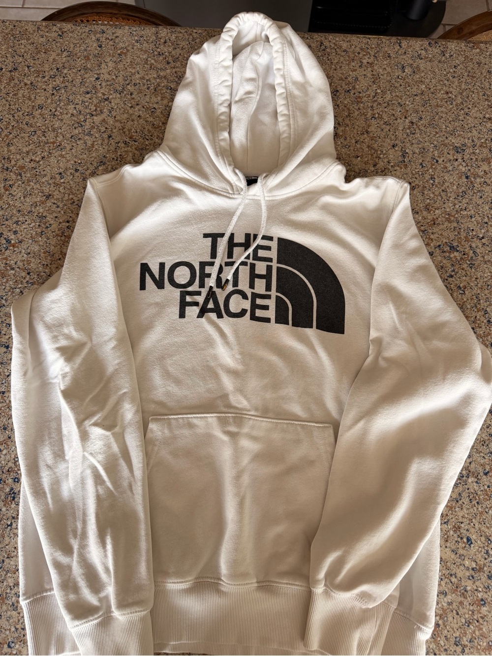 The North Face Men’s white hoodie  with Black Logo